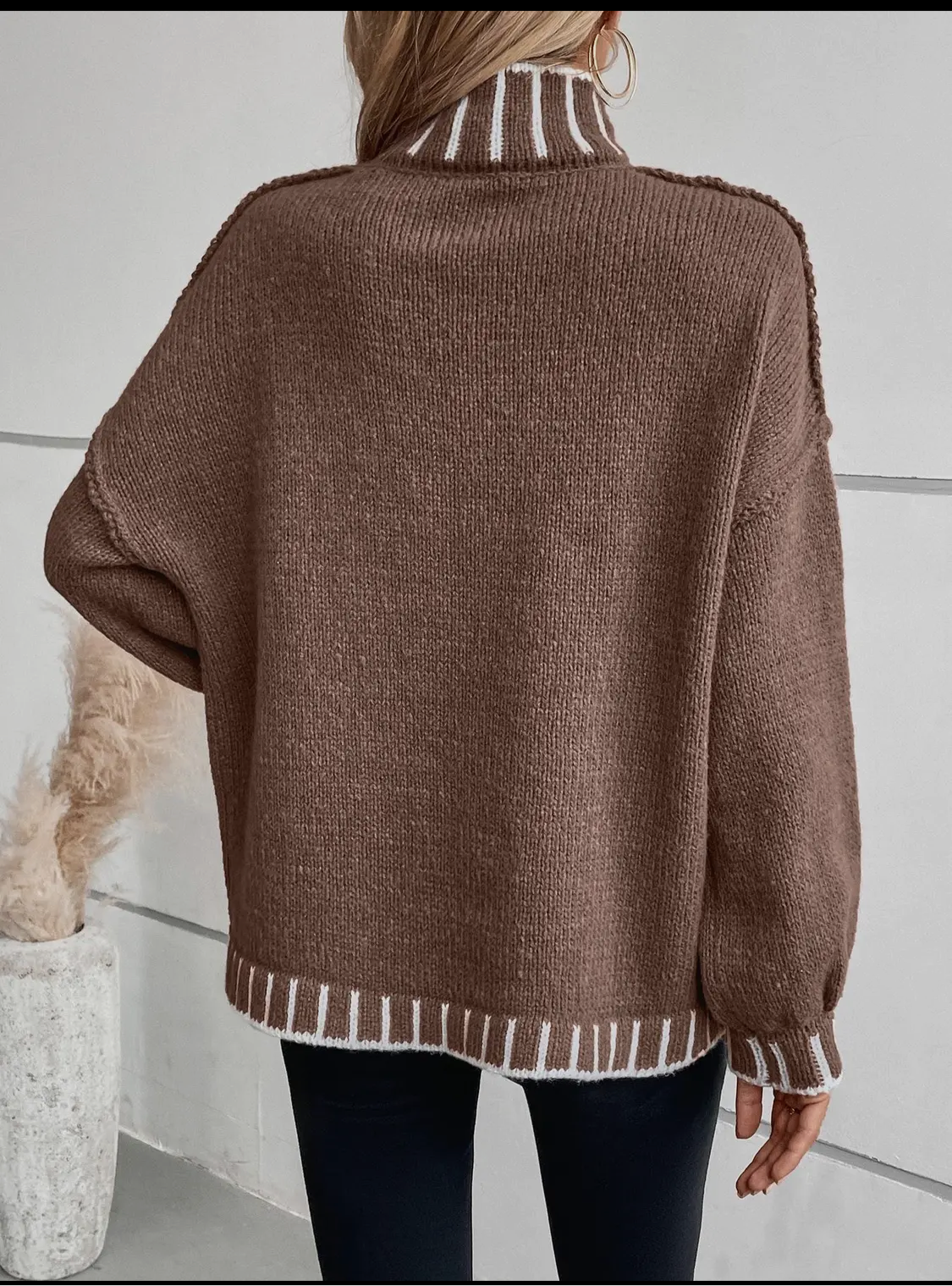 Brown sweater with white trim stitching